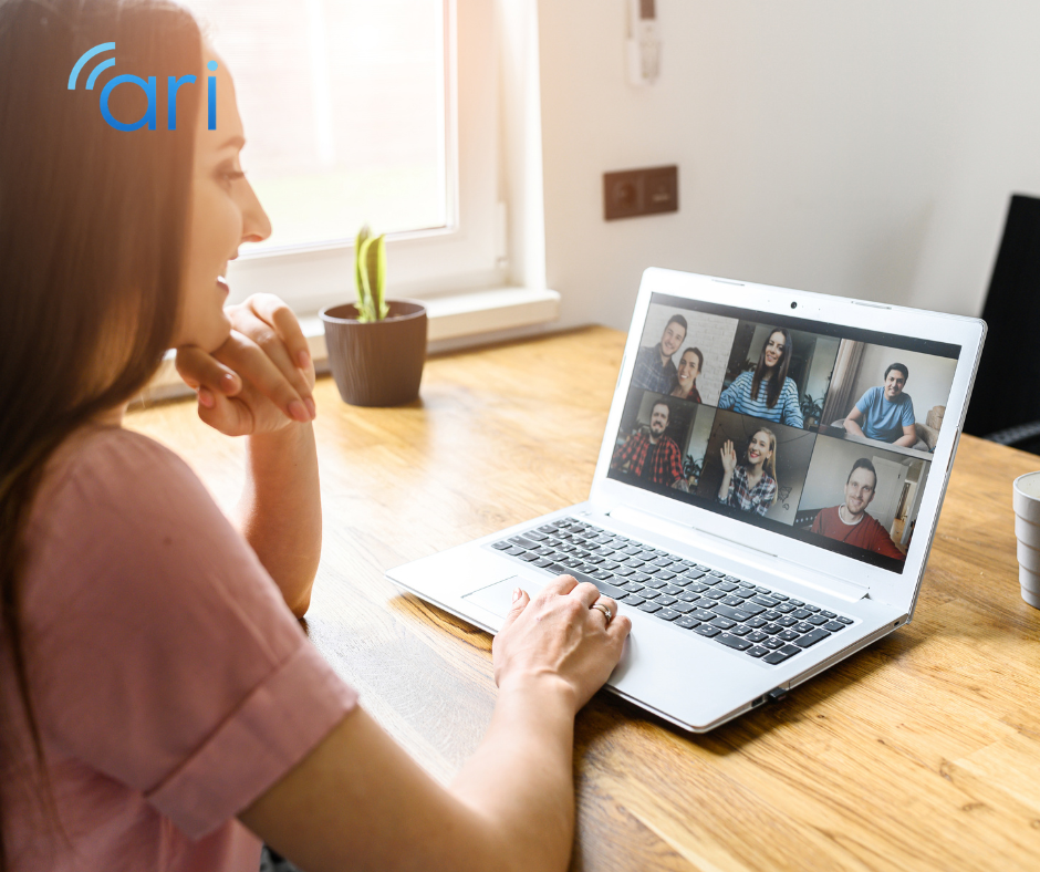 Woman participating in a virtual team meeting on a laptop at home, illustrating remote work accessibility and inclusive online collaboration.