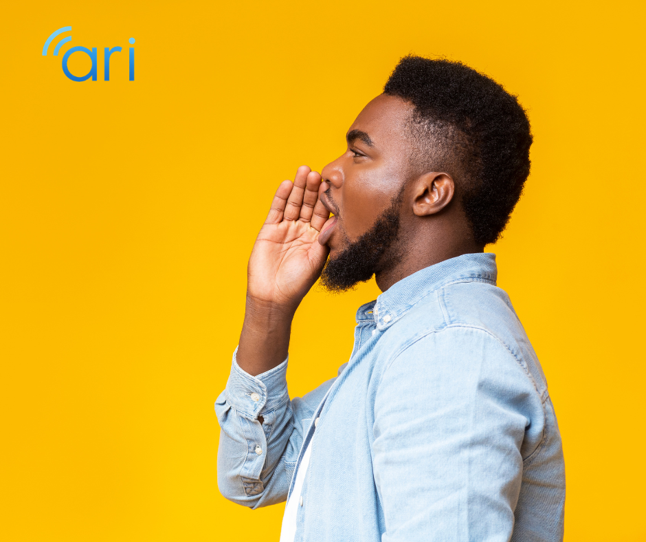 Side profile of a man shouting with his hand near his mouth, illustrating a common misconception that raising one's voice helps communication with Deaf or hard of hearing individuals.